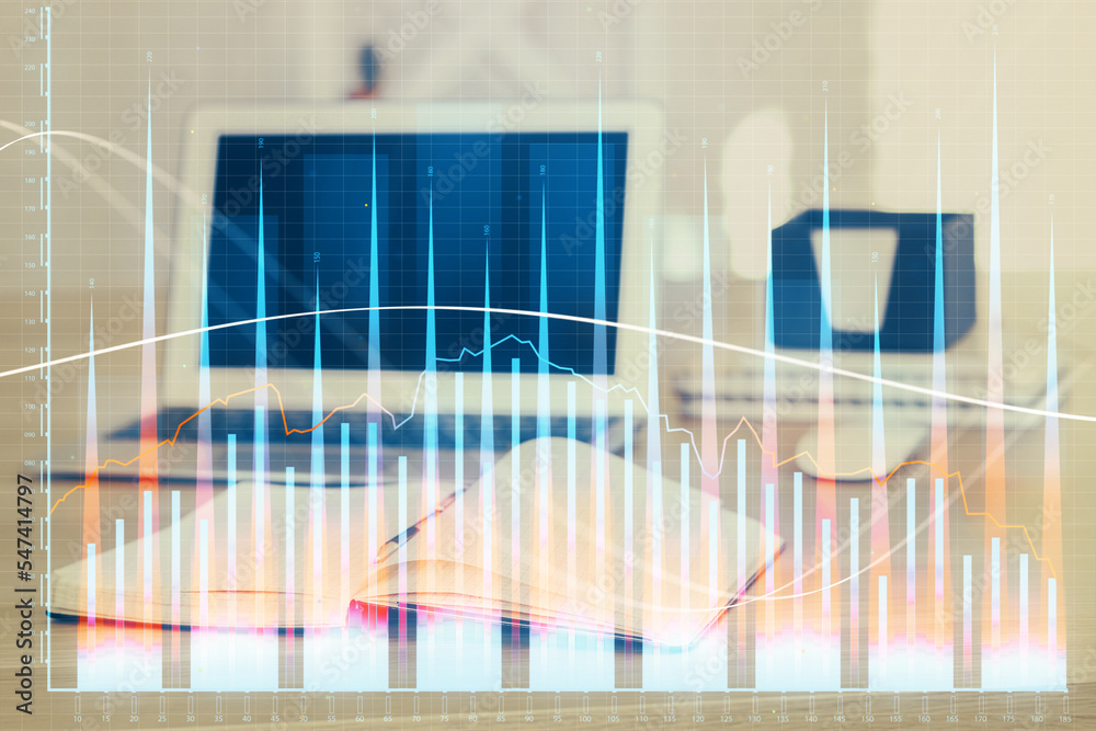Stock market graph on background with desk and personal computer. Double exposure. Concept of financial analysis. Stock market graph on background with desk and personal computer. Double exposure. Concept of financial analysis.
