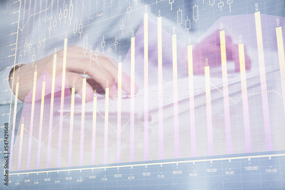 Double exposure of graph with man typing on computer in office on background. Concept of hard work. Closeup. Double exposure of graph with man typing on computer in office on background. Concept of hard work. Closeup.
