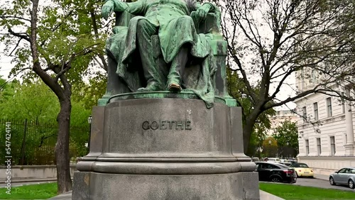 Vienna, Austria, August 2022. Slow motion footage with tilt motion of Goethe statue, Vienna, Austria, Europe. photo