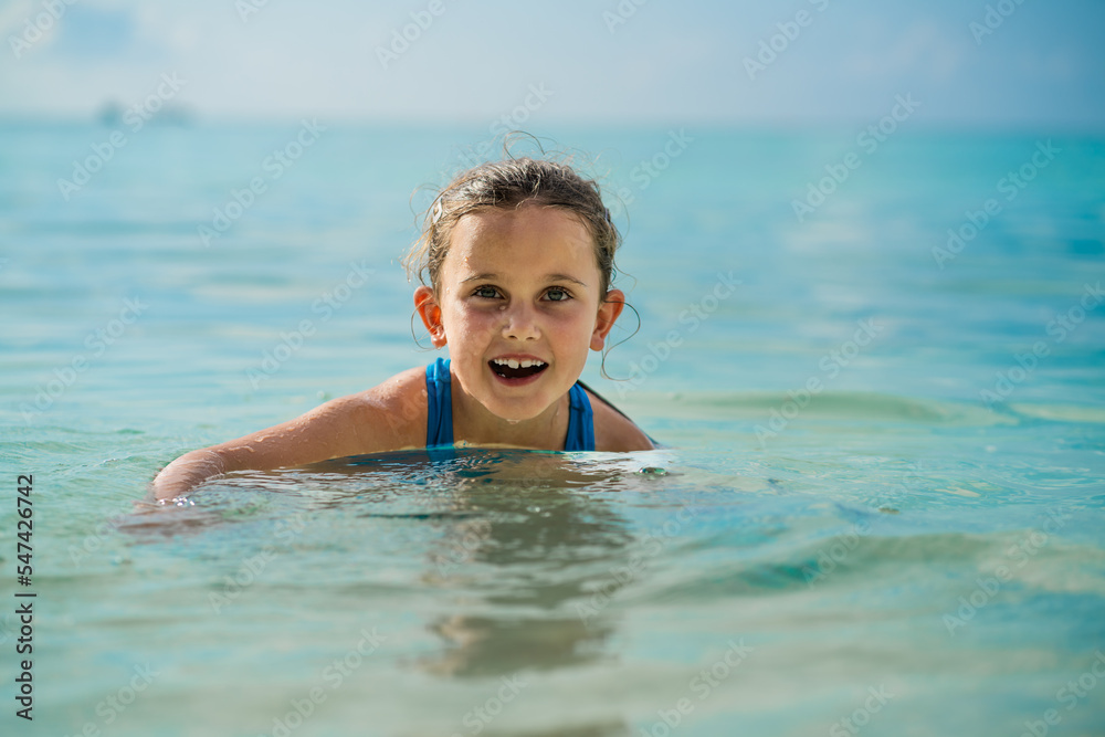 Kid Learning Swimming With Swimming Disc Or Ring Kid Learning Swimming With Swimming Disc Or Ring