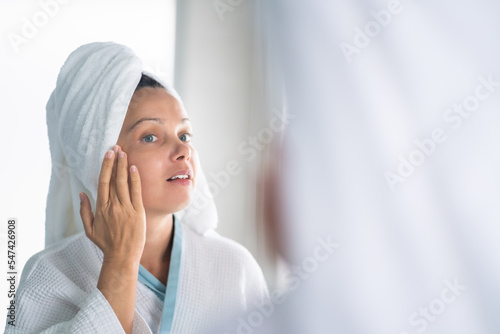 Woman Squeezing Pimple On Her Face