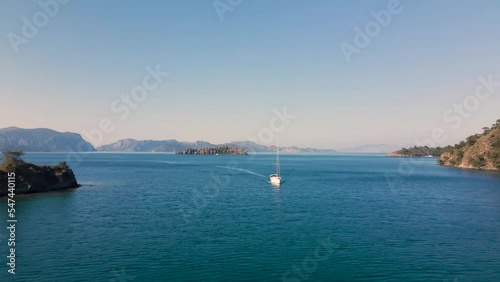 Beautiful seashore. Islands in the distance. Colorful blue sea. The beauty of Turkey. Beautiful rocks and mountains. Sunny clear day. Beautiful water.