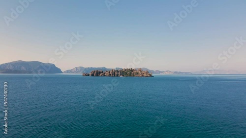 Beautiful seashore. Islands in the distance. Colorful blue sea. The beauty of Turkey. Beautiful rocks and mountains. Sunny clear day. Beautiful water.