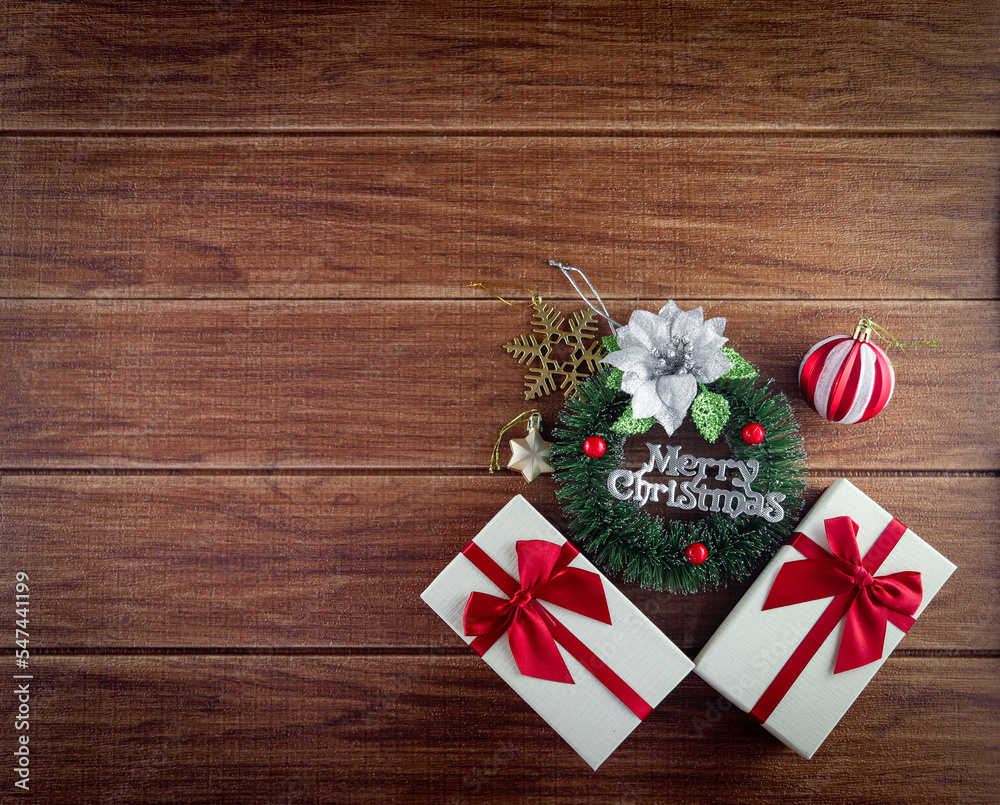Christmas holiday composition, beautiful Xmas black board framed decoration items and gift box, calibration winter holiday wooden background with festive decorative elements and copy space for text Christmas holiday composition, beautiful Xmas black board framed decoration items and gift box, calibration winter holiday wooden background with festive decorative elements and copy space for text
