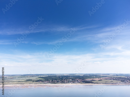 birds eye view above the sea looking at the coastline of england
