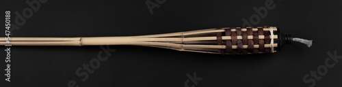 bamboo torch on black background photo