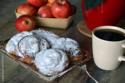 Spanish sweet bread spiral-shaped and sprinkled with powdered sugar. Perfect for breakfast. Rustic style.