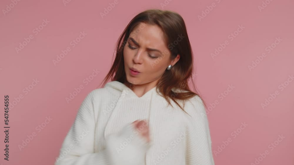 Happy joyful woman in casual sweater shouting, raising fists in gesture I did it, celebrating success, winning, birthday, lottery jackpot goal achievemen. Adult girl indoors on pink studio background Happy joyful woman in casual sweater shouting, raising fists in gesture I did it, celebrating success, winning, birthday, lottery jackpot goal achievemen. Adult girl indoors on pink studio background
