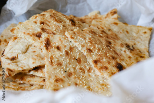Fresh traditional Persian bread - sangak - in white tissue