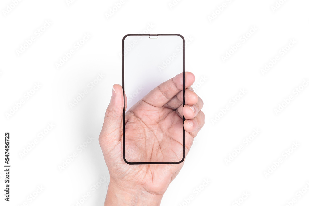 The hand holds a protective screen for a mobile phone. White background. Close-up. The hand holds a protective screen for a mobile phone. White background. Close-up.