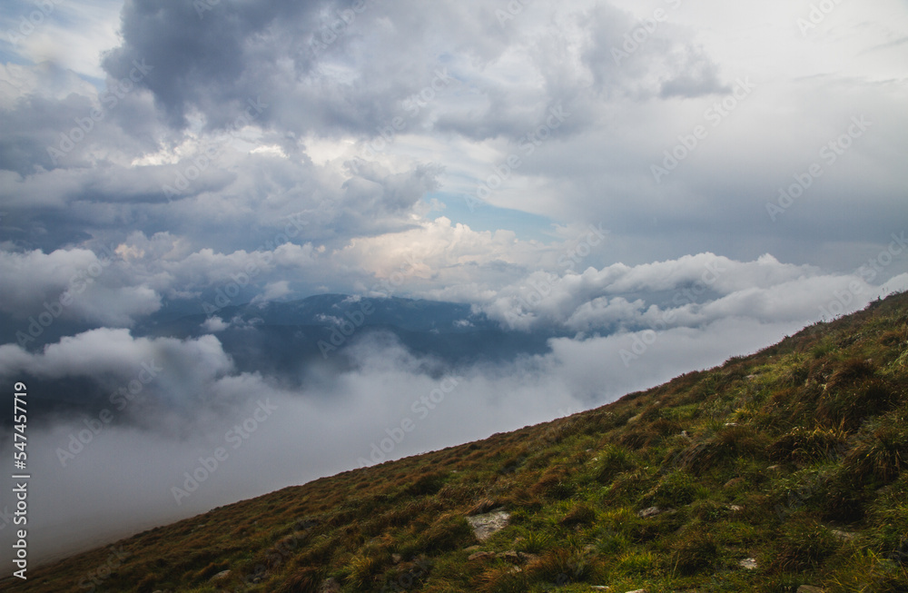 Beautifull over clouds view of Chornohora highest mountain range in Western Ukraine after the storm.