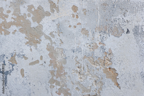 White grunge old concrete stucco wall texture background. Abstract weathered peeled plaster wall with falling off flakes of paint background
