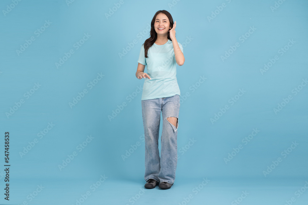 Beautiful woman walking On a blue background, she is happy. Beautiful woman walking On a blue background, she is happy.