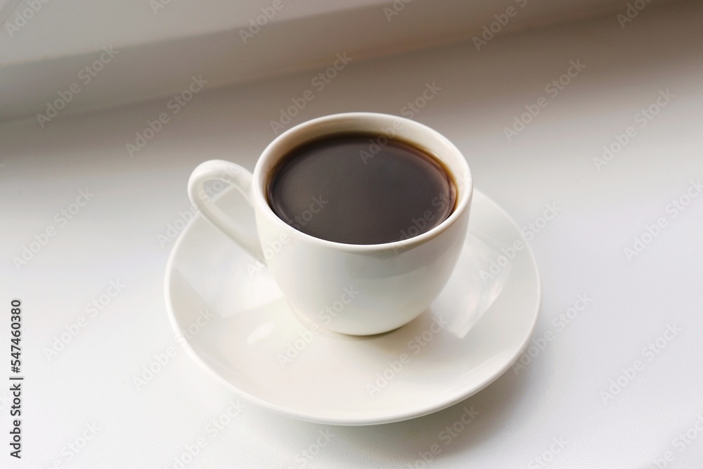 A small cup of coffee on the table. Closeup, top view photography A small cup of coffee on the table. Closeup, top view photography