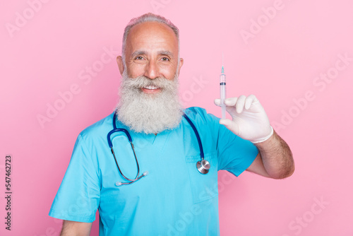 Photo of man virologist hold syringe advertise vaccine against covid 19 isolated on pastel color background