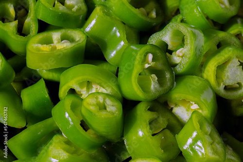Closeup view of chopped green spicy pepper.