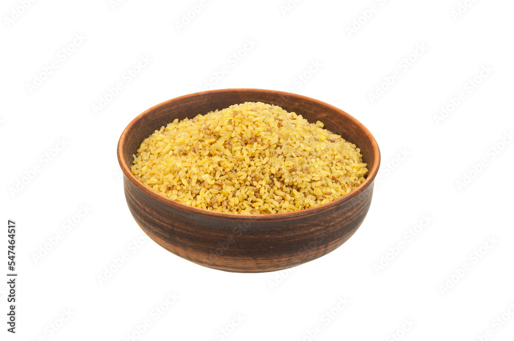 bulgur in a clay bowl on a white background. the concept of a good harvest of bulgur bulgur in a clay bowl on a white background. the concept of a good harvest of bulgur