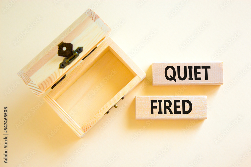 Quiet fired symbol. Concept words Quiet fired on wooden blocks. Beautiful white table white background. Empthy wooden chest. Business and quiet fired concept. Copy space. Quiet fired symbol. Concept words Quiet fired on wooden blocks. Beautiful white table white background. Empthy wooden chest. Business and quiet fired concept. Copy space.