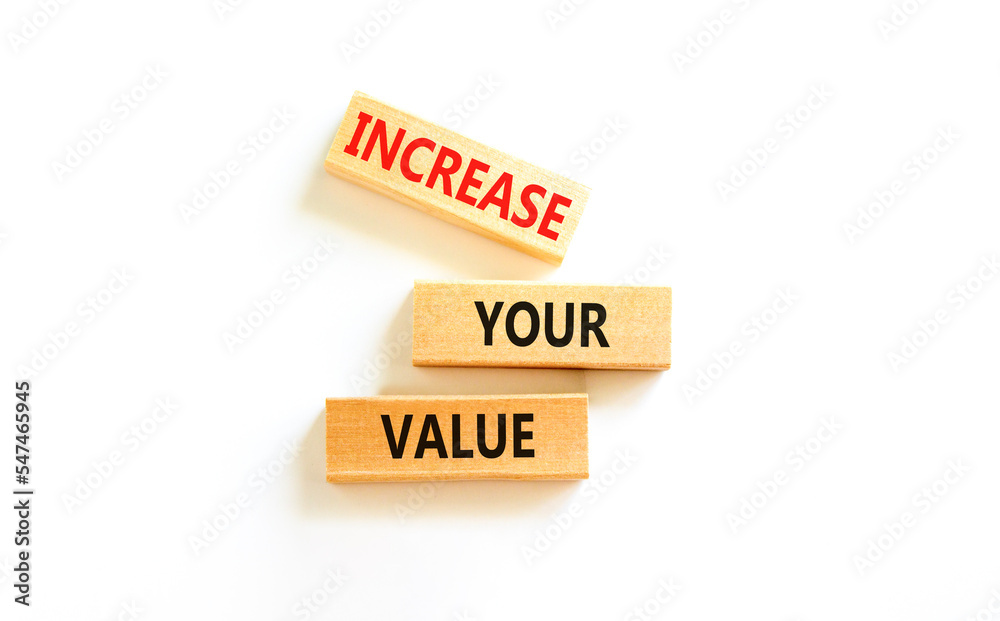 Increase your value symbol. Concept words Increase your value on wooden blocks on a beautiful white table white background. Business increase your value concept. Copy space. Increase your value symbol. Concept words Increase your value on wooden blocks on a beautiful white table white background. Business increase your value concept. Copy space.