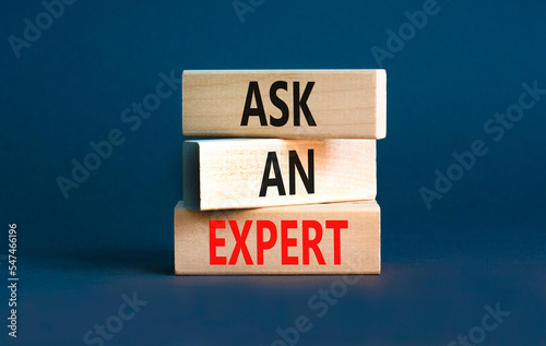 Ask an expert symbol. Concept words Ask an expert on wooden blocks on a beautiful grey table grey background. Business and ask an expert concept. Copy space. © Dzmitry