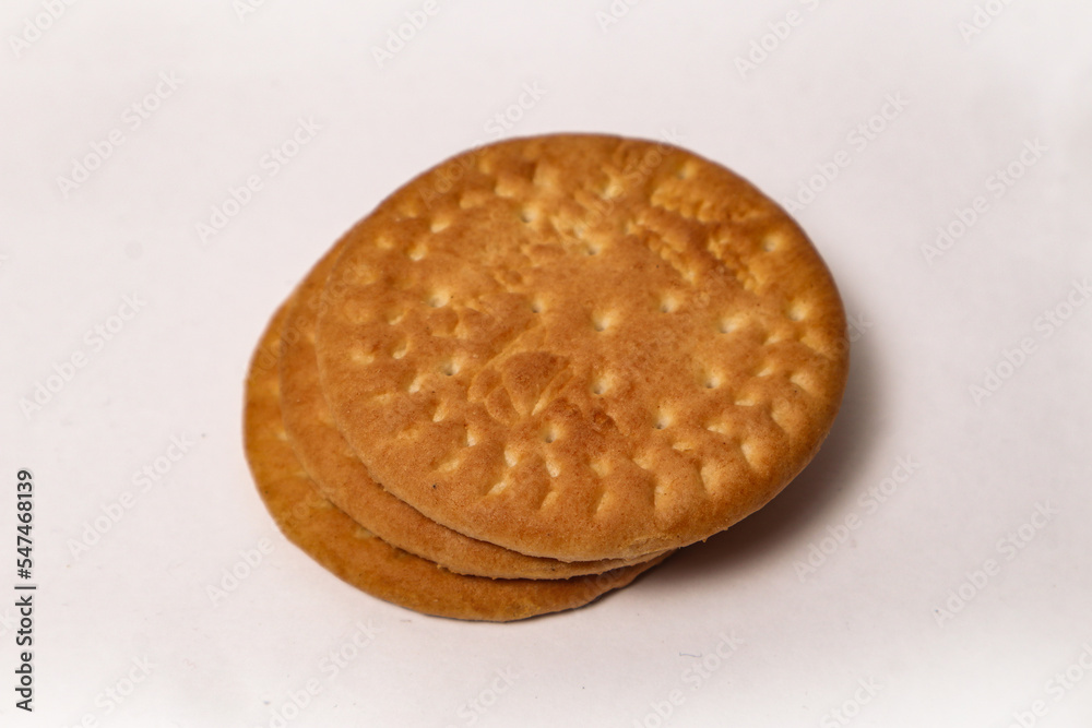 Wheat biscuits in the steel plate with blury background. Indian