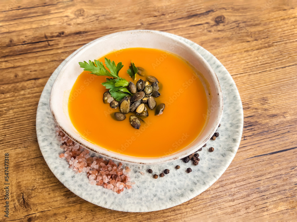 Pumpkin traditional soup with creamy texture . Top view Pumpkin traditional soup with creamy texture . Top view