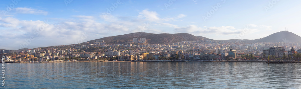 Homes and Buildings in a Touristic Town by the Aegean Sea. Kusadasi, Turkey. Colorful Sunrise Sky Art Render. Panoramic View
