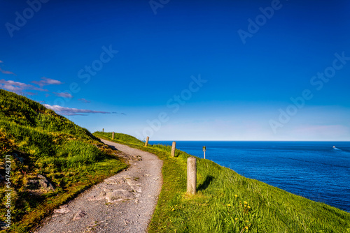 Trail at Signal Hill Saint John Newfoundland Canada with blue ocean as background © Aqnus