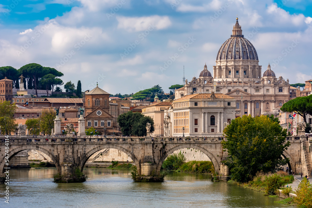 Fototapeta premium St Peter's basilica in Vatican and St. Angel bridge over Tiber river in Rome, Italy