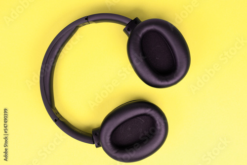 Full-size headphones on a yellow background