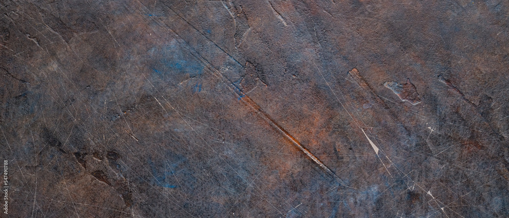 Dark abstract background of scratched surface. Faded paint texture. Grunge surface vintage backdrop