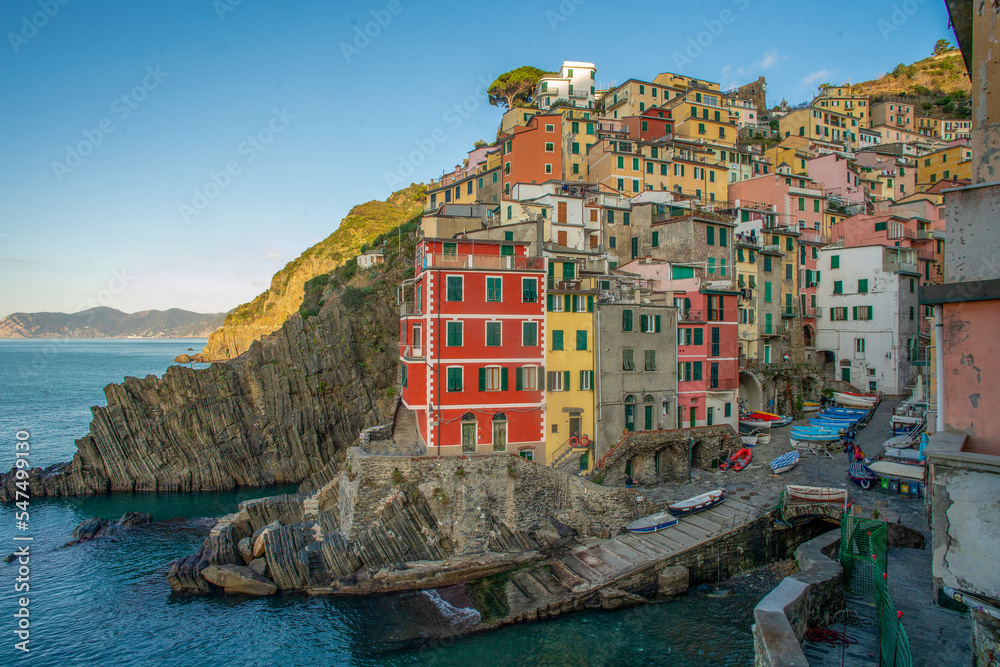 Awe Riomaggiore town on Liguria coast in Italy -  fantastic small colorful buildings on rocky hill . Travel on Christmas