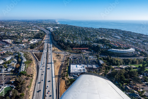 Aerial view of automobiles on Interstate 5 by Encinitas in San Diego California on a clear day with the Pacific ocean in the background photo