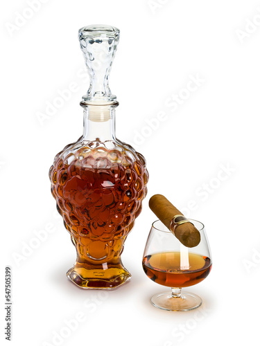 decanter with cognac, glass and cigar