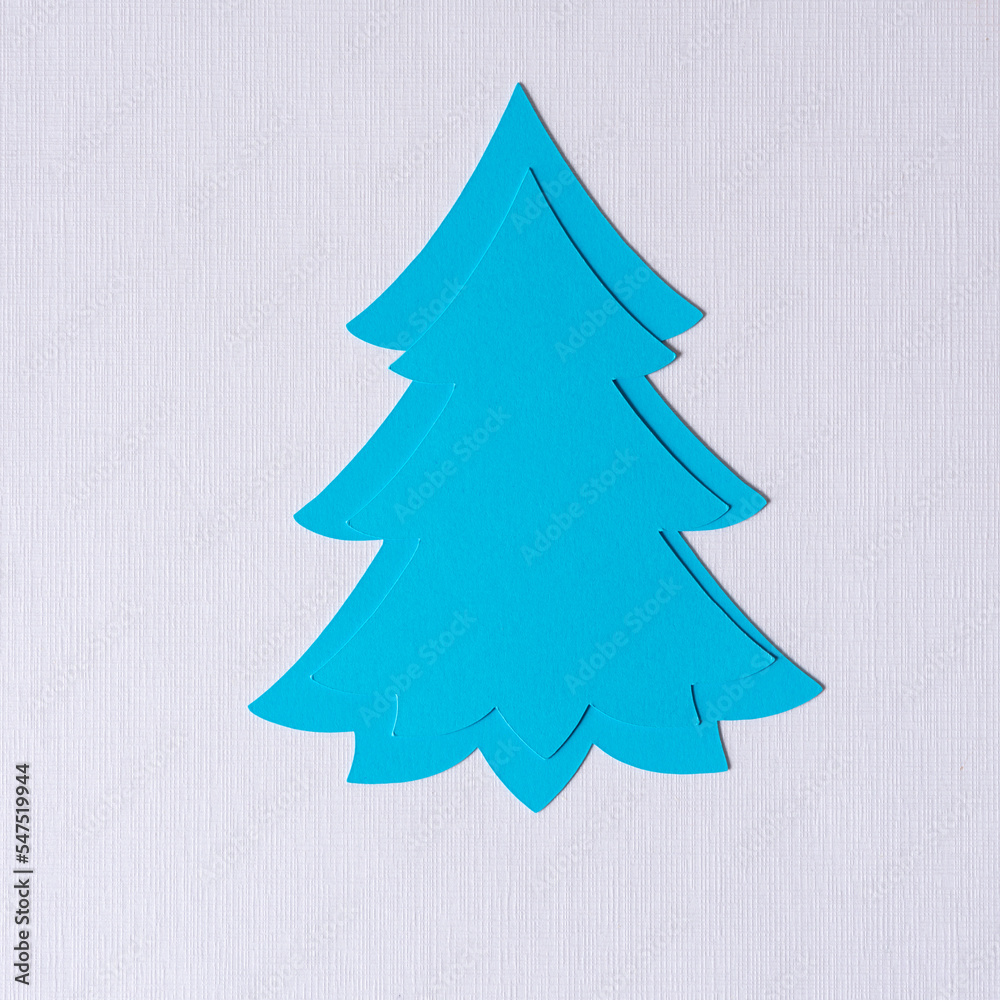 Fototapeta premium holiday paper tree designs on textured paper