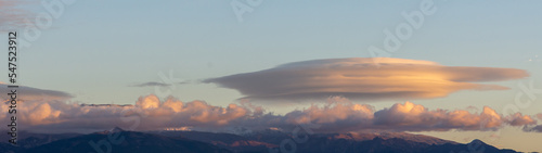 Lenticular clouds at sunset over the Sierra Nevada mountains (Spain)