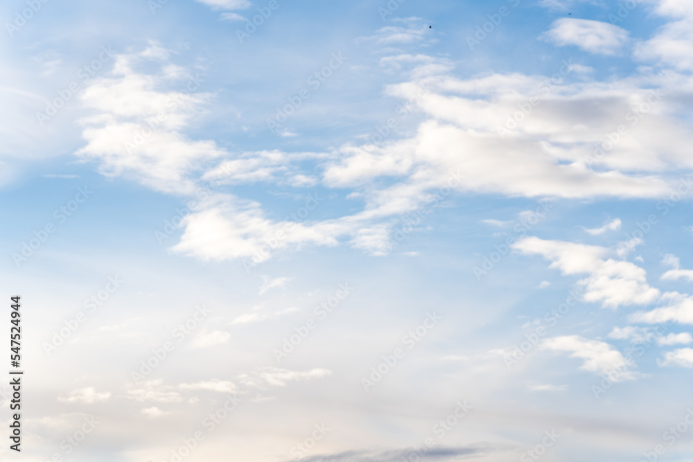 A beautiful blue autumn sky with white fluffy clouds makes for a fabulous overall view of the sky A beautiful blue autumn sky with white fluffy clouds makes for a fabulous overall view of the sky