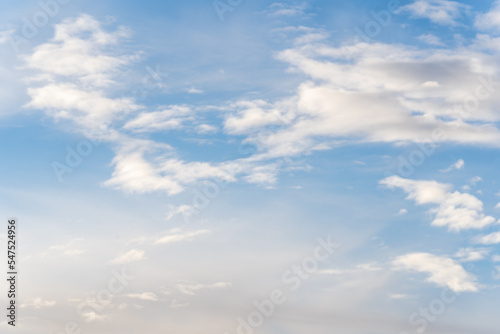 Fototapeta Naklejka Na Ścianę i Meble -  A beautiful blue autumn sky with white fluffy clouds makes for a fabulous overall view of the sky