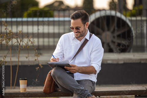 Portrait of businessman witht some documents photo