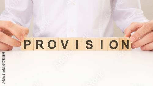 PROVISION word made with building blocks, business concept photo