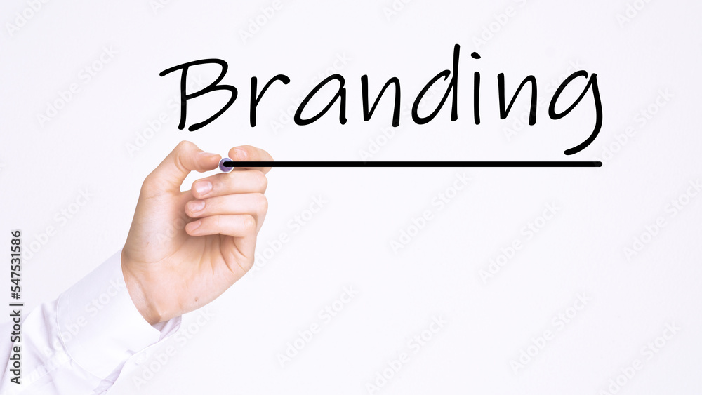 businessman writing BRANDING with marker on transparent board. education concept businessman writing BRANDING with marker on transparent board. education concept