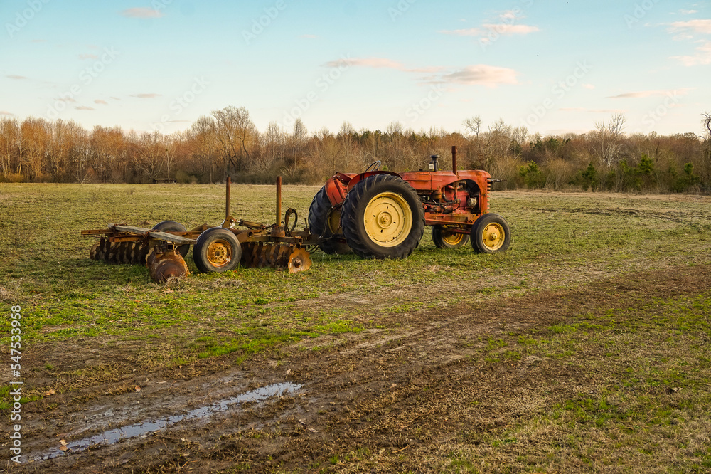 Obraz premium old tractor in field
