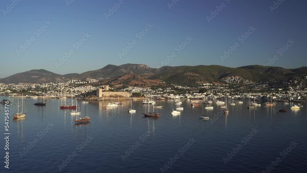 Aerial view of Bodrum bay, Turkey. Seashore, sailboats, boats, mountains and fort in Bodrum. 