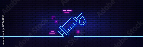 Neon light glow effect. Medical syringe line icon. Medicine vaccine sign. Pharmacy medication symbol. 3d line neon glow icon. Brick wall banner. Medical syringe outline. Vector