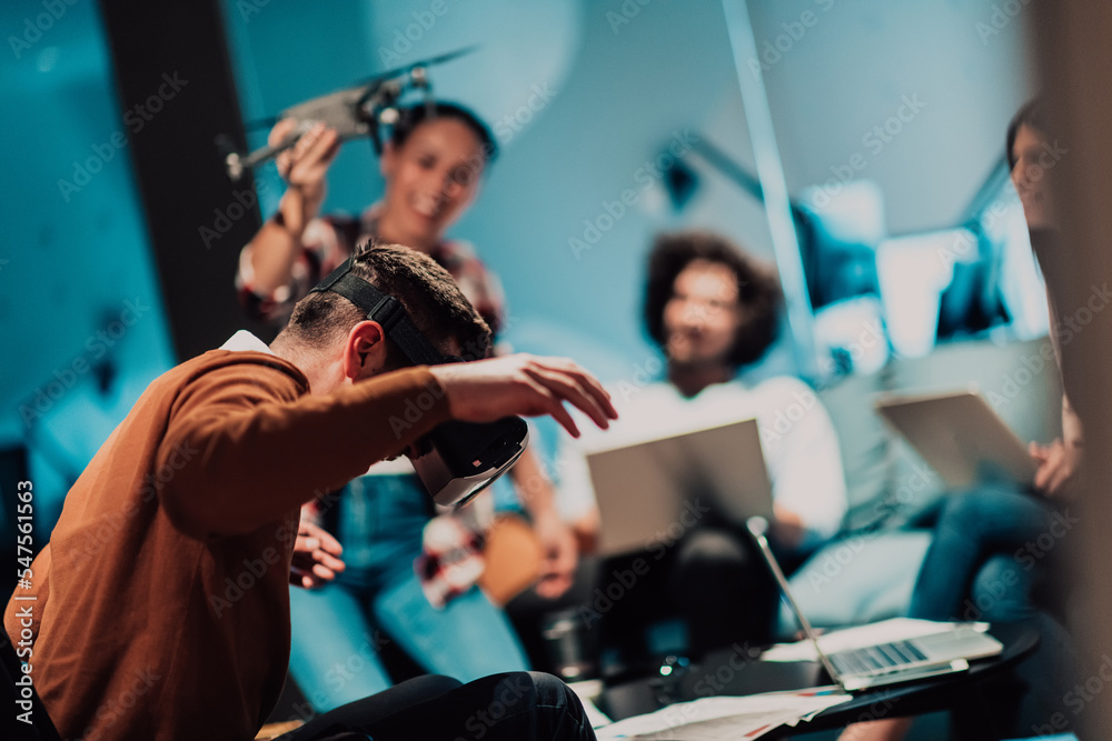 Business persons with a disability at work in modern open space coworking office on team meeting using virtual reality goggles. Business persons with a disability at work in modern open space coworking office on team meeting using virtual reality goggles.