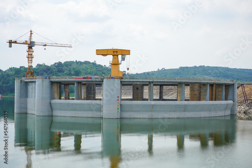 Jatiluhur, the Largest Dam in Indonesia. Multi-Purpose Embankment Dam on The Citarum River with Morning Glory Spillway in Purwakarta, West Java, Indonesia. photo