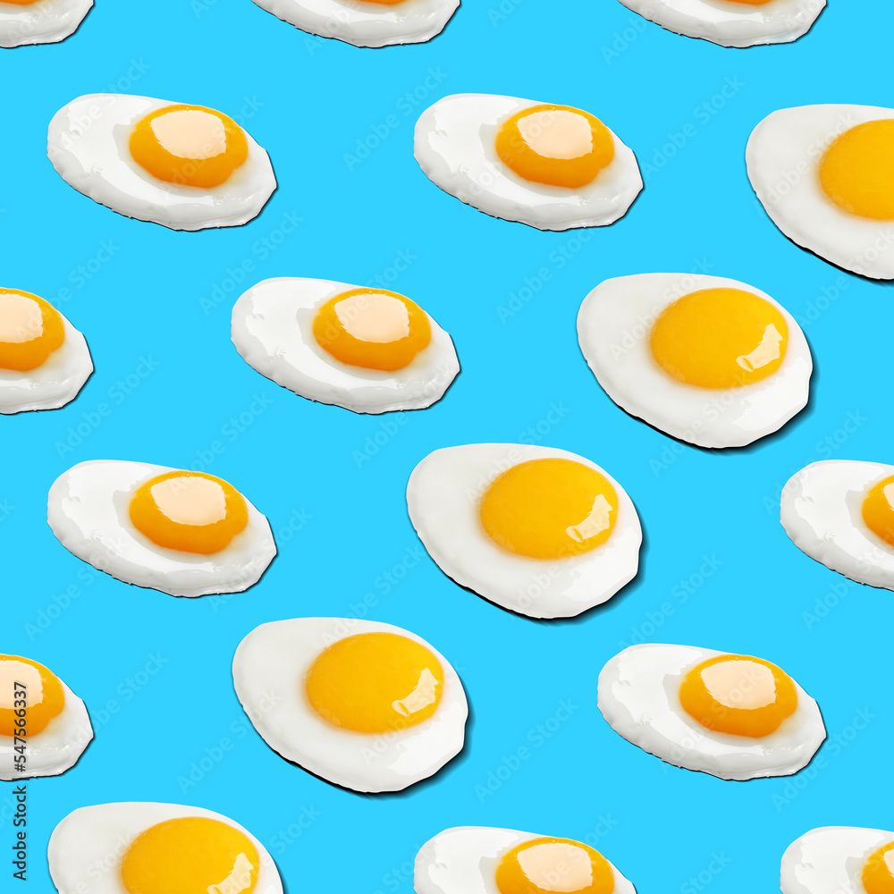 Many tasty fried chicken eggs on light blue background Many tasty fried chicken eggs on light blue background