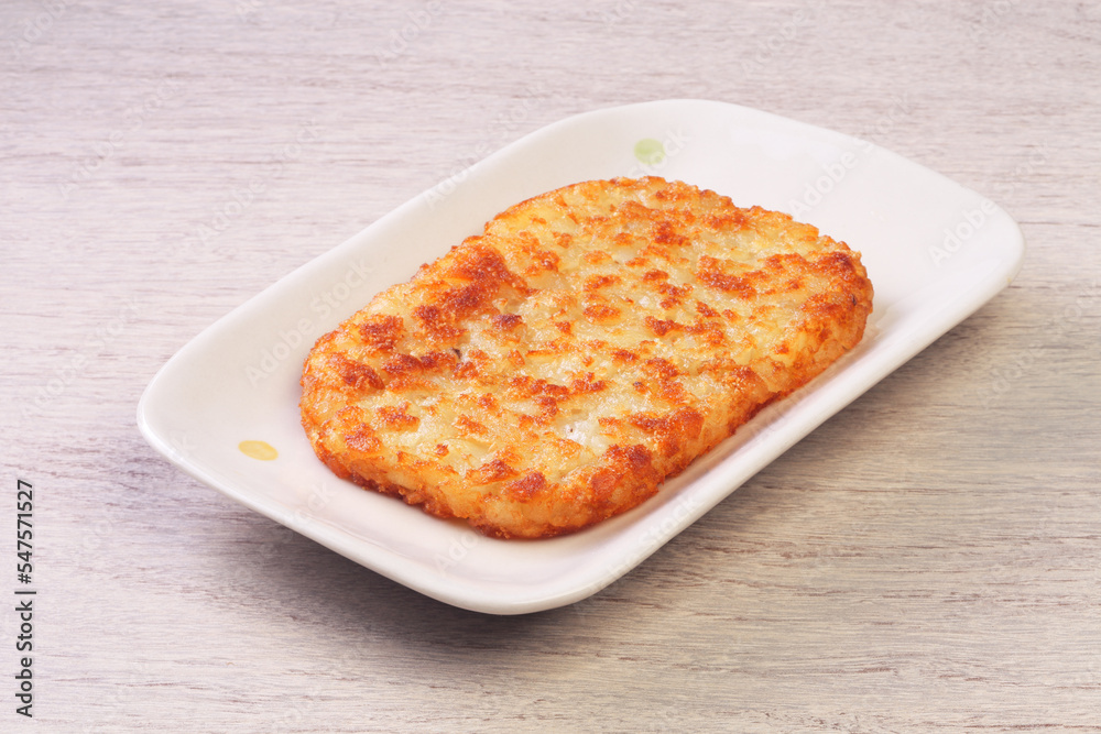 Hash browns on white plate Hash browns on white plate