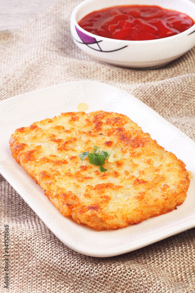 Hash browns on white plate Hash browns on white plate