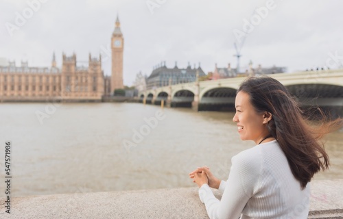 Asian female tourists Travel in London, England at the Big Ben Clock Tower area.Concept of foreign tourism After the epidemic situation of covid.